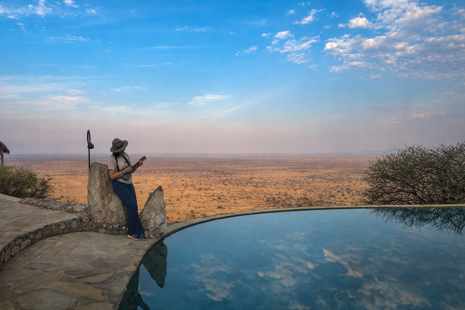 Playing a ukulele overlooking Kenya’s wide open landscape